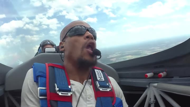Doug Byrd at the end of the sequence, head back, mouth open, clouds behind the canopy.